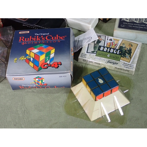 463 - A Box of Puzzle Games including, Rubik's Cube, Rubik's Triamid, etc.