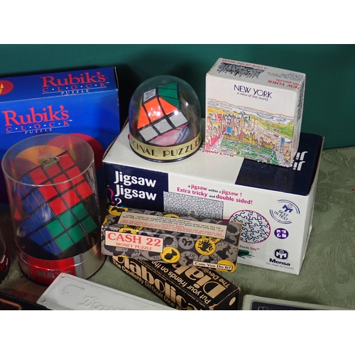 463 - A Box of Puzzle Games including, Rubik's Cube, Rubik's Triamid, etc.