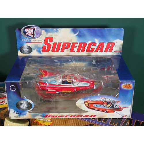 466 - A box of vintage Toys and Models including, Supercar, Batmobile, ET, the Simpsons, etc.