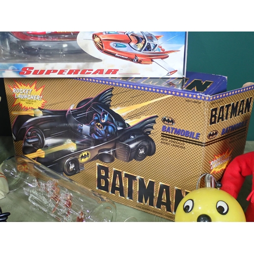 466 - A box of vintage Toys and Models including, Supercar, Batmobile, ET, the Simpsons, etc.