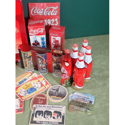 467 - Quantity of Coca Cola Bottles, Glasses, and other advertising items, a box of Beer Mats and Teddy Be... 