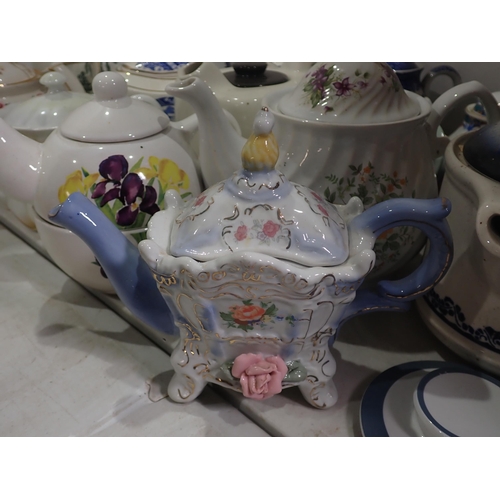 526 - A collection of various Teapots