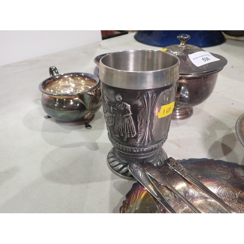 538 - A quantity of silver plated and metal ware including Beaker embossed with tavern scene, Muffin Dish ... 