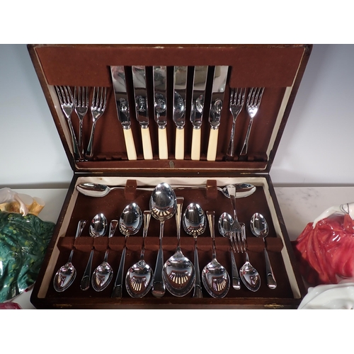 551 - Six Royal Doulton Figurines and a Canteen of cutlery