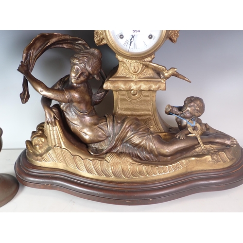 554 - A gilt metal Mantel Clock with reclining girl and cherub in the manner of Moreau, and an Oil Lamp