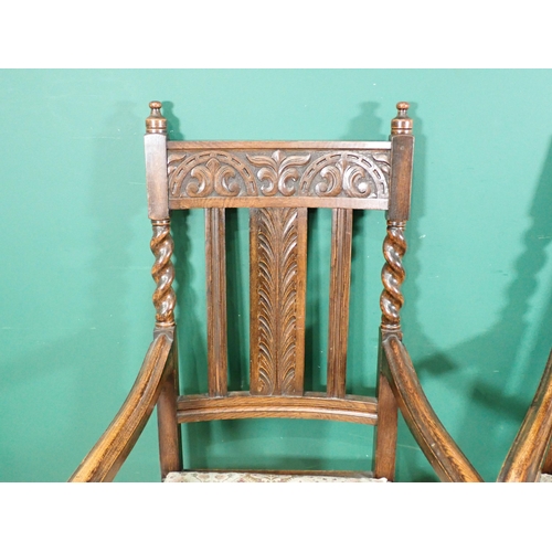 606 - A pair of oak Armchairs with lunette and leafage carved rail and floral upholstered drop in seats