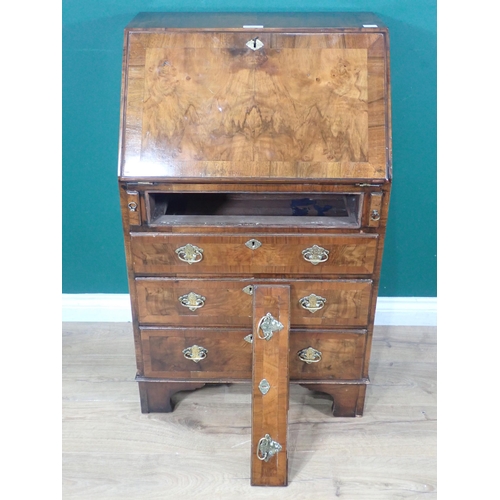 607 - A Georgian walnut veneered Bureau with fall front enclosing fitted interiors above dummy drawer and ... 