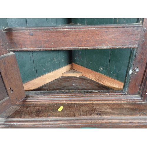 612 - An 18th Century oak Corner Cupboard on later stand with arched fielded panel door 5ft 10in H x 2ft W