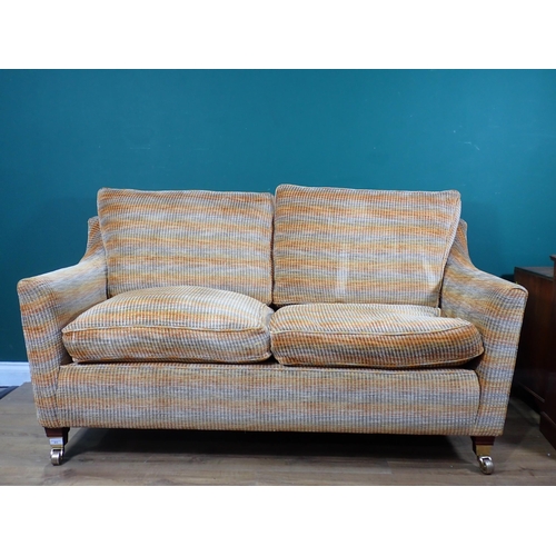 613 - A two seater Sofa with orange and green upholstery 5ft 5in W x 2ft 8in H