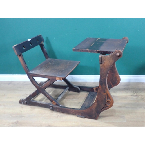 614 - A stained pine metamorphic Elbow Chair