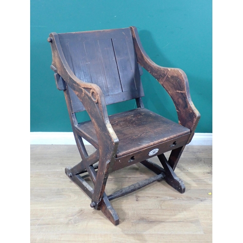 614 - A stained pine metamorphic Elbow Chair