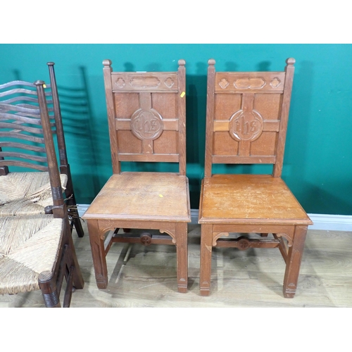 625 - A pair of Arts and Crafts oak Hall Chairs with carved initials on panel back and a pair of rush seat... 