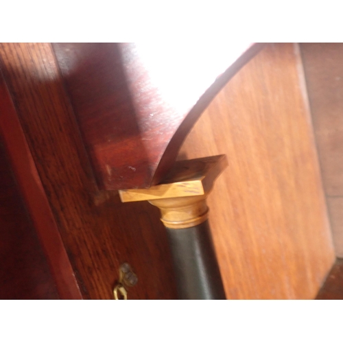 643 - A 19th Century mahogany Escritoire fitted fall front above pair of cupboard doors between turned col... 