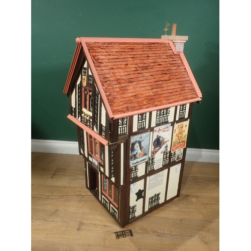 646 - A timber framed style Doll's House 'Griffindor' with Dolls and Furniture 2ft 9in H x 1ft 6in W