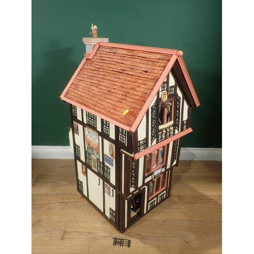 646 - A timber framed style Doll's House 'Griffindor' with Dolls and Furniture 2ft 9in H x 1ft 6in W