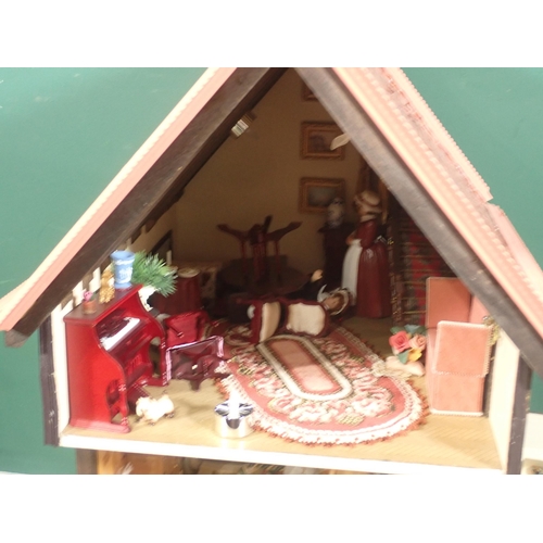 646 - A timber framed style Doll's House 'Griffindor' with Dolls and Furniture 2ft 9in H x 1ft 6in W