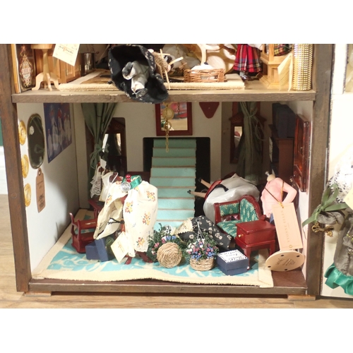 646 - A timber framed style Doll's House 'Griffindor' with Dolls and Furniture 2ft 9in H x 1ft 6in W