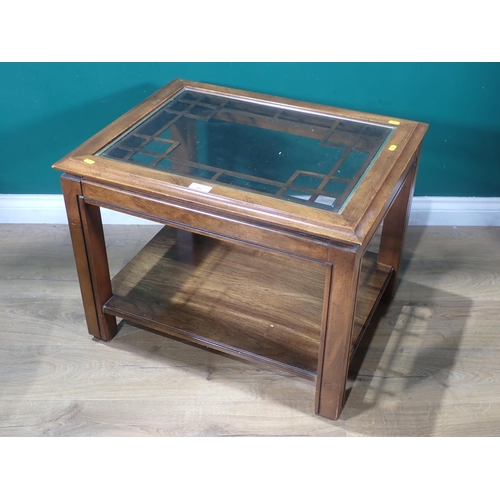 651 - A glass topped Coffee Table, a yew Bedside Chest and an oval two tier Occasional Table