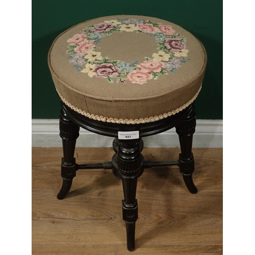 657 - A Victorian ebonised revolving Piano Stool