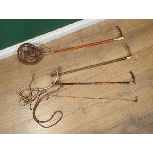 661 - Three antler handled Hunting Whips and a Ladies Riding Whip