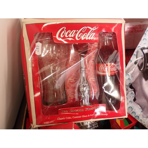 687 - A box of Coca Cola advertising Collectibles