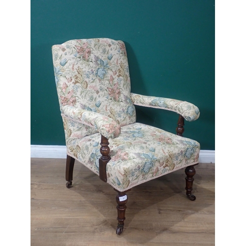 77 - A 19th Century oak framed open Armchair with floral upholstery