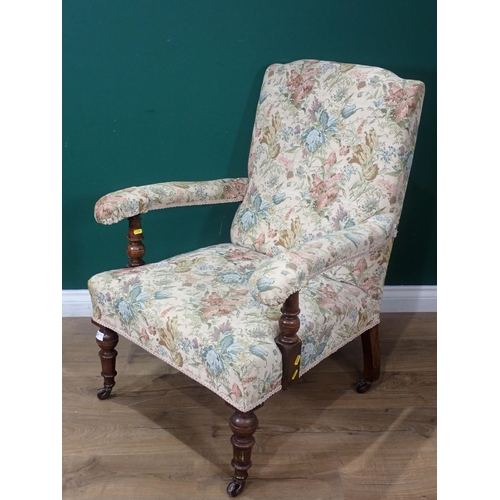 77 - A 19th Century oak framed open Armchair with floral upholstery