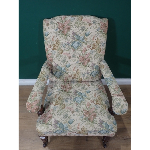 77 - A 19th Century oak framed open Armchair with floral upholstery