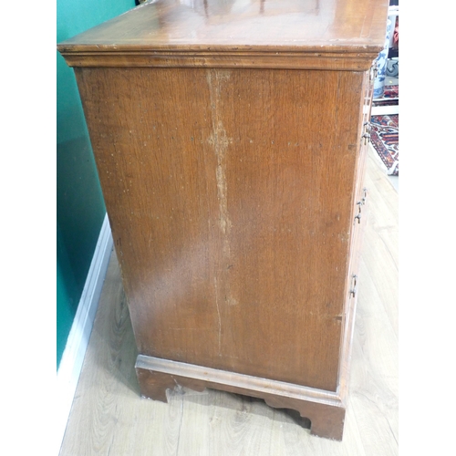 80 - An Georgian style walnut veneered Chest of three short and three long drawers mounted on bracket fee... 