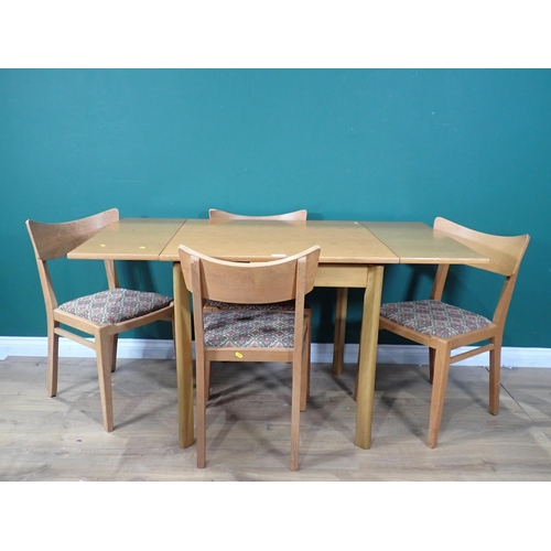 88 - A draw leaf Kitchen Table and four Chairs, the chairs stamped (EG - G Plan).