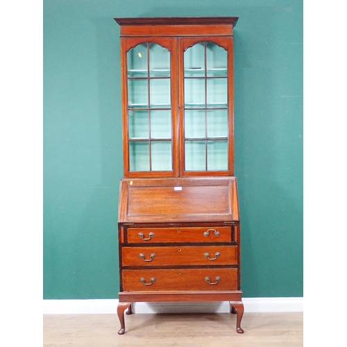 89 - An Edwardian mahogany Bureau Bookcase fitted pair of glazed doors above three drawers mounted on cab... 