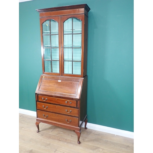 89 - An Edwardian mahogany Bureau Bookcase fitted pair of glazed doors above three drawers mounted on cab... 