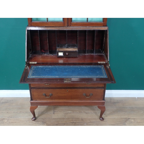 89 - An Edwardian mahogany Bureau Bookcase fitted pair of glazed doors above three drawers mounted on cab... 