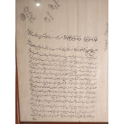 299 - A framed Persian Document, said to be a contract, with seal marks and signatures, 17 x 13 1/2in