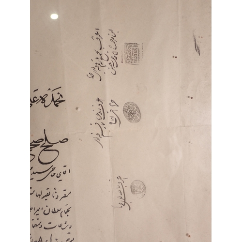 299 - A framed Persian Document, said to be a contract, with seal marks and signatures, 17 x 13 1/2in