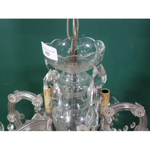 433 - A six branch glass Electrolier with scroll shaped arms and tear shaped drops