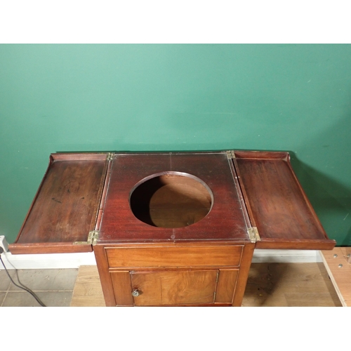 561 - A 19th Century mahogany Washstand with fold out top above cupboard door and drawers 2ft 7in H x 1ft ... 