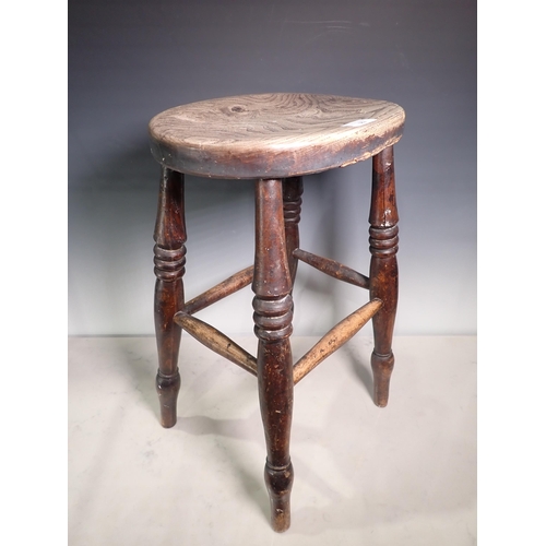 562 - An antique ash and elm Stool