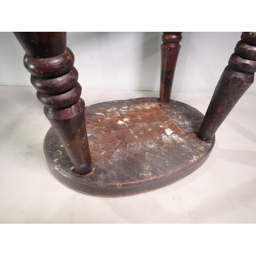 562 - An antique ash and elm Stool