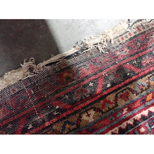 667 - Two red ground Persian Rugs with designs of stylised flowers 5ft 10in L x 3ft 10in W and 7ft 2in L x... 