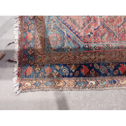 667 - Two red ground Persian Rugs with designs of stylised flowers 5ft 10in L x 3ft 10in W and 7ft 2in L x... 