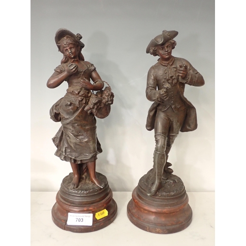 346 - A pair of spelter Figures of lovers on circular bases, 14in H