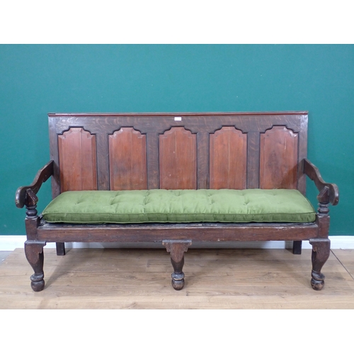 354 - An 18th Century and later oak Settle with fielded mahogany panel back mounted on cabriole front supp... 