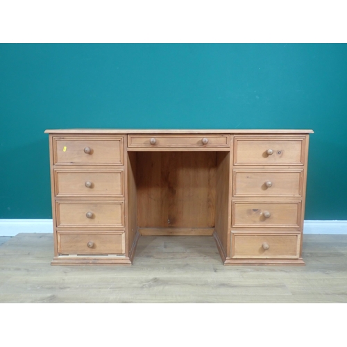 376 - A modern pine Desk fitted nine drawers 4ft 8in W x 2ft 6in H