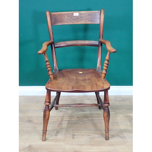 348 - An antique beech wood bar-back Elbow Chair