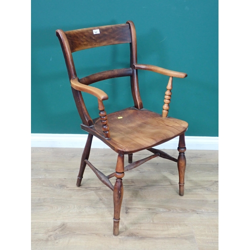 348 - An antique beech wood bar-back Elbow Chair