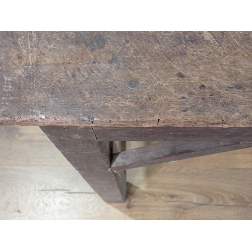 26 - An antique oak Farmhouse Table with plank top on square cut supports and end stretchers 4ft W x 2ft ... 