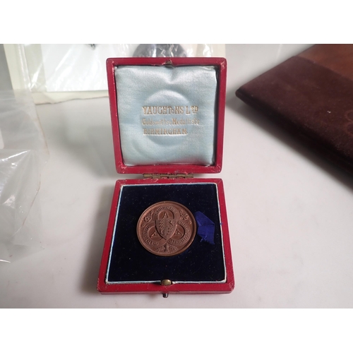 301 - A tray of sporting Medals and Badges, a plated Olympic Buckle, a silver Masonic Badge, etc.