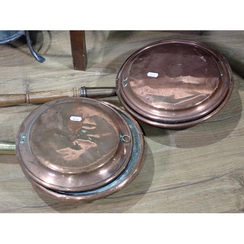 311 - A cane backed Elbow Chair, a Deed's Tin, a metal circular Stand and two Warming Pans