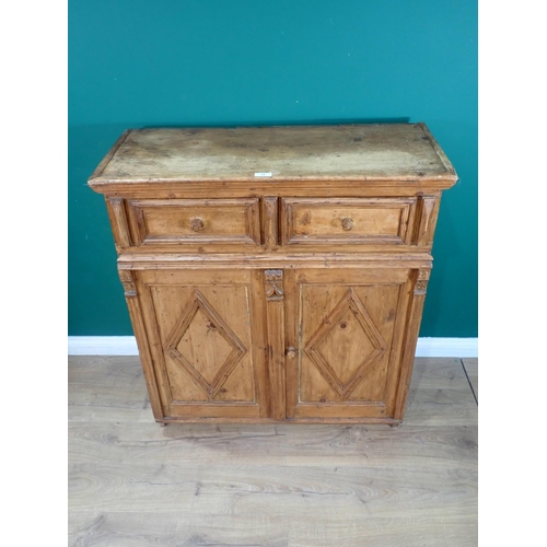 32 - A 19th Century Continental pine Cupboard fitted two frieze drawers above pair of doors 3ft 7in H x 3... 